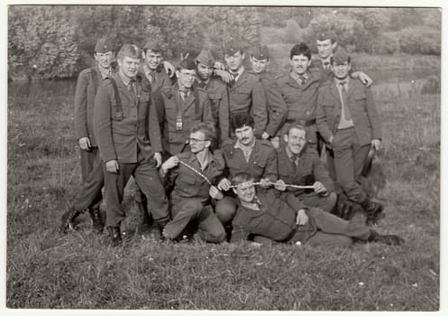 THE CZECHOSLOVAK SOCIALIST REPUBLIC - CIRCA 1970s: Vintage photo shows soldiers pose outdoors. Black & white antique photo.