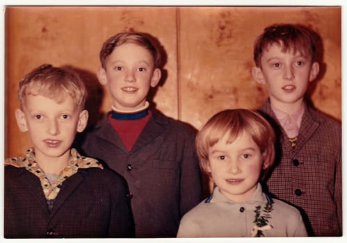 THE CZECHOSLOVAK SOCIALIST REPUBLIC - CIRCA 1970s: Vintage photo shows a group of children pose indoors. Colour photography.