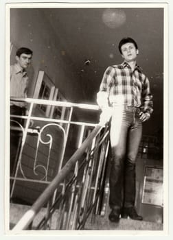 THE CZECHOSLOVAK SOCIALIST REPUBLIC - CIRCA 1980s: Vintage photo shows boys in the hall of residence (dormitory). Antique black & white photo.