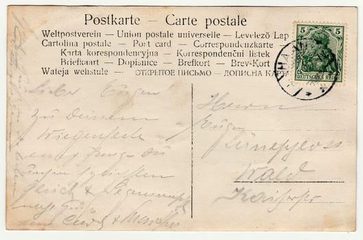 GERMANY - CIRCA 1940s: Back of a vintage photo - used postcard. Rich stain and paper details. Can be used as background. Postcard contains handwriting.