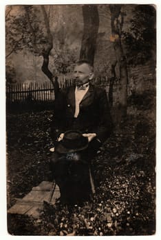 THE CZECHOSLOVAK REPUBLIC - CIRCA 1930s: Vintage photo shows elderly man poses outdoors. Black white photography.