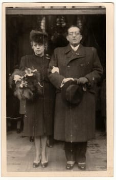 THE CZECHOSLOVAK SOCIALIST REPUBLIC - CIRCA 1960s: Vintage photo shows wedding guests, parents of bride. Black white antique photography.