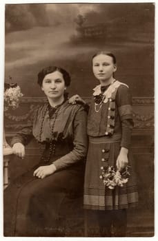 THE CZECHOSLOVAK REPUBLIC - CIRCA 1930s: Vintage studio photo shows mother and daughter. Black white antique photography.