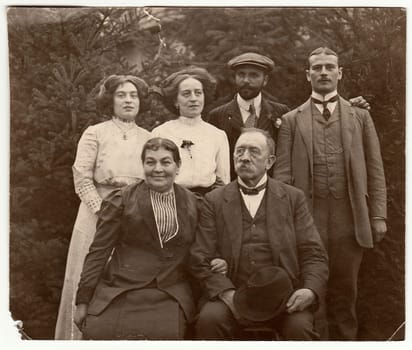 THE CZECHOSLOVAK REPUBLIC - CIRCA 1930s: Vintage photo shows parents and their mature children. Black white antique photography.