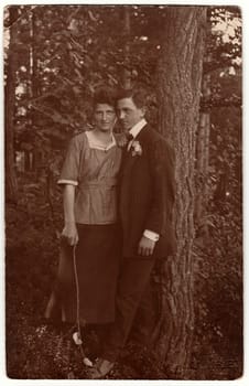 THE CZECHOSLOVAK REPUBLIC - CIRCA 1940s: Vintage photo shows young lovers outdoors. Black white antique photography.