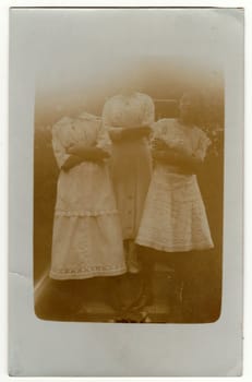 THE CZECHOSLOVAK REPUBLIC - CIRCA 1930s: Vintage photo shows girls pose outdoors. Antique black white photography. Note: strong blurriness