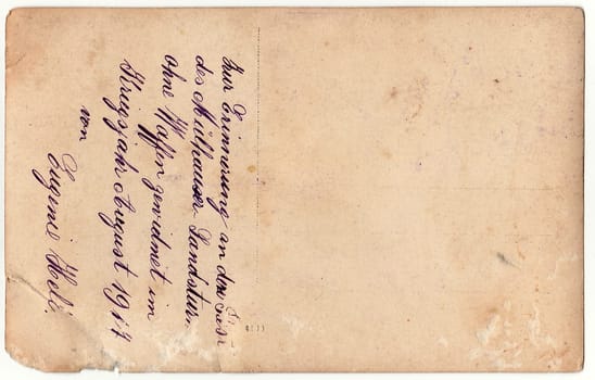 GERMANY - 1917: Back of a vintage photo - used postcard. Rich stain and paper details. Can be used as background. Image contains handwriting.