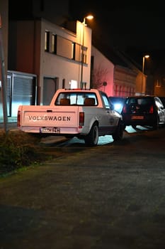 White, lowered Volkswagen Caddy on the side of the road