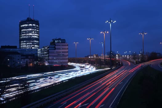 High-angle of cars in a traffic jam during evening light trails on the rouds rush hour