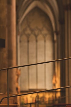 Vertical shot of details of pews and railings in Cologne Cathedral in Cologne, Germany