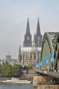 Vertical shot of the Hohenzollern Bridge and the Cologne Cathedral in Cologne, Germany