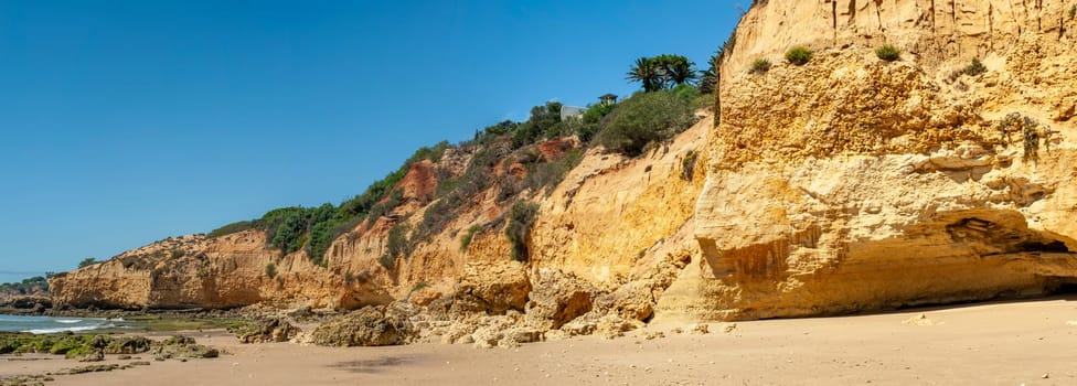 Maria Luisa beach with rock formation in Albufeira, Algarve, Portugal.