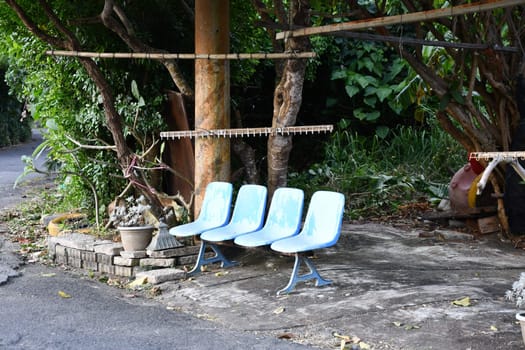 Blue bench made of single chairs near Cape Eluanbi, Taiwan.