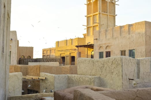 Dubai, UAE. Buildings and houses of traditional historical architecture of the old city of the Emirates in the Persian Gulf. The clay houses of Al Sifa. Deira, Burdubai.