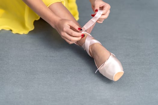 ballet shoes on the feet of a ballerina. High quality photo