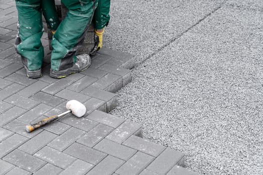 construction of a sidewalk from concrete blocks.