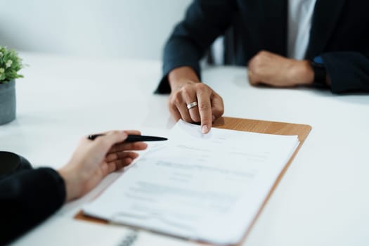 The signing of important documents between the lawyer and the client to enter into an agreement in a court case.