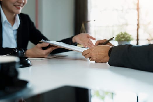 The signing of important documents between the lawyer and the client to enter into an agreement in a court case.