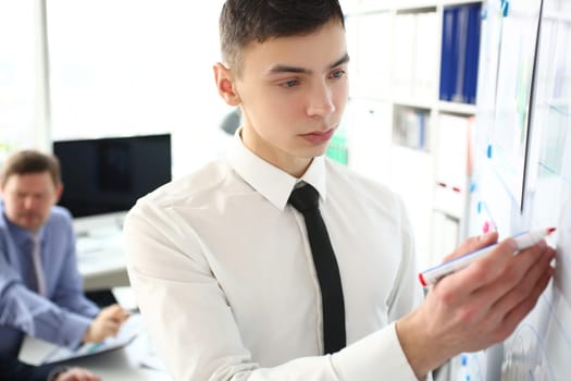 Business man conducts business training for colleagues in office closeup. Creating new business project concept