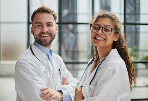 portrait of two medical workers in the hospital looking at the camera