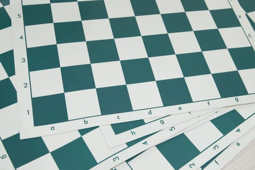 Lot of green soft vinyl chess boards.