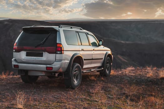 SUV crossover car at sunset. Travel and journey 4wd car.