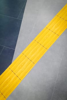 Walkway or yellow tactile tiles for the blind peoples in the urban environment.