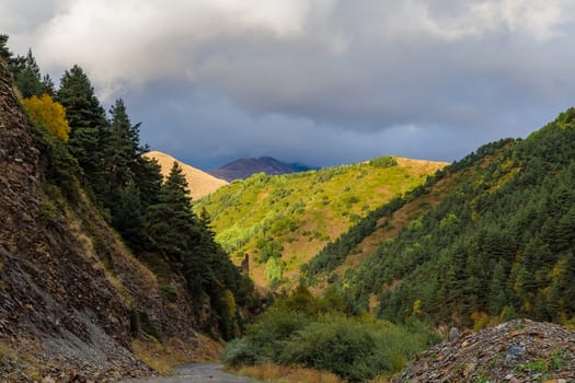 Highlands of North Ossetia. Mountains of the Caucasus. High mountains in the rays of the setting sun