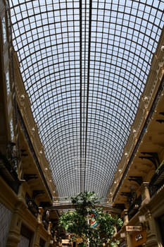 Interior of the Gum department store with the glass roof in Moscow, Russia