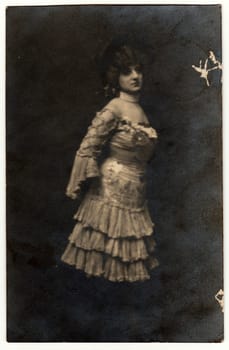 GUBEN, GERMANY - MARCH 6, 1906: Vintage photo shows woman wears a period dress with frills.