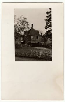 THE CZECHOSLOVAK REPUBLIC - CIRCA 1930s: Vintage photo shows rural house. Black white antique photography.