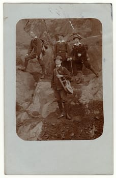 GERMANY - APRIL 23, 1916: Vintage photo shows young men during the trip in the nature on the mountains .