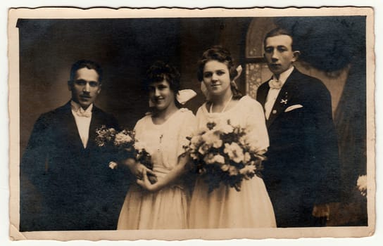 THE CZECHOSLOVAK REPUBLIC - CIRCA 1930s: Vintage photo of two newlyweds couples. Black & white antique studio portrait.