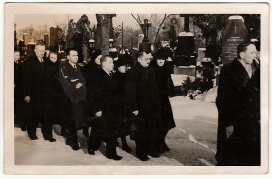 THE CZECHOSLOVAK REPUBLIC - CIRCA 1940s: Vintage photo shows people during funeral. Black & white antique photo.