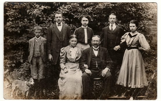 THE CZECHOSLOVAK REPUBLIC - CIRCA 1930s: Vintage photo shows a big civic family poses outdoors. Black & white antique photography.