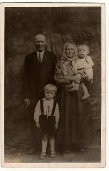 THE CZECHOSLOVAK REPUBLIC - CIRCA 1930s: Vintage photo shows a rural family. Black & white antique photography.
