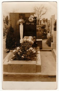 PRAGUE, THE CZECHOSLOVAK REPUBLIC - DECEMBER 3, 1939: Vintage photo shows a grave. Black & white antique photography.