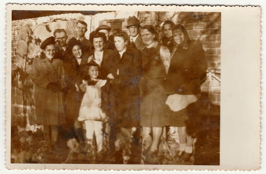 THE CZECHOSLOVAK REPUBLIC - CIRCA 1950s: Vintage photo shows a big family poses outdoors. Black & white antique photography.