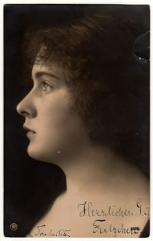 BERLIN, GERMANY - APRIL 12, 1906: The vintage photo shows portrait of young woman. The studio photography was taken in early 20th century.