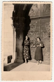 DUBROVNIK RAGUSA , CROATIA - AUGUST 13, 1936: Vintage photo shows the elegant women on summer holiday vacation in Croatia.