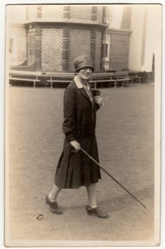 LUHACOVICE, THE CZECHOSLOVAK REPUBLIC - CIRCA 1930s: Vintage photo shows the elegant woman at the spa resort. Black white antique photography.