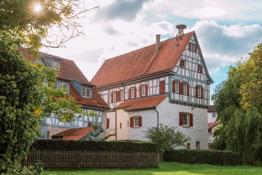 Traditional Small House With Beautiful Outdoor Decor Facade In Germany. German Old Brick Building House Ancient European City German Architect.