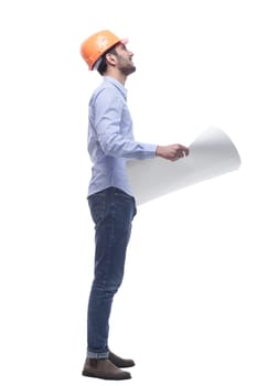 side view. male architect looking at a drawing of a new project . isolated on a white background.