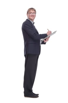 side view.senior business man making notes in the clipboard. isolated on a white background.
