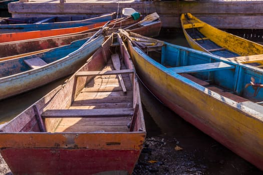 Idyllic Porto Seguro Beach at sunset with fishermen rustic wooden boats, BAHIA, Brazil