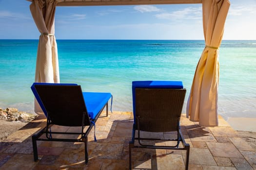 Tropical caribbean beach with turquoise waters in idyllic Montego Bay, Jamaica