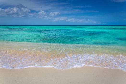 Arashi secluded beach on Aruba island at sunny day, Caribbean sea