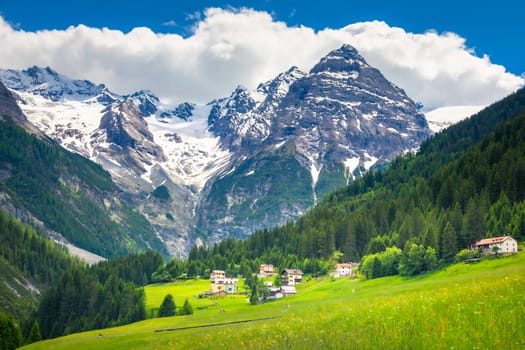 Idyllic village in Stelvio pass valley and Ortler massif, italian Dolomites at springtime, Italy