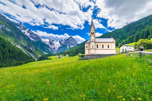 Idyllic village in Stelvio pass valley and Ortler massif, italian Dolomites at springtime, Italy