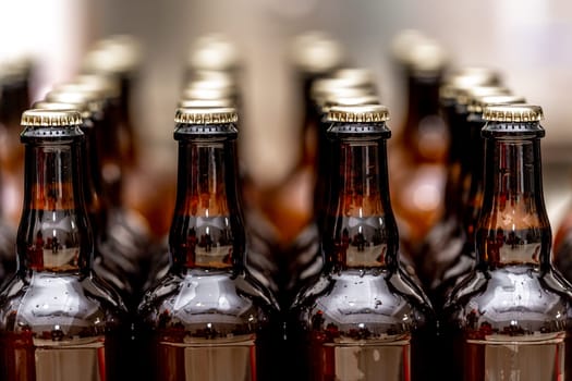 full bottles of beer in a row in the warehouse ready for export. High quality photo